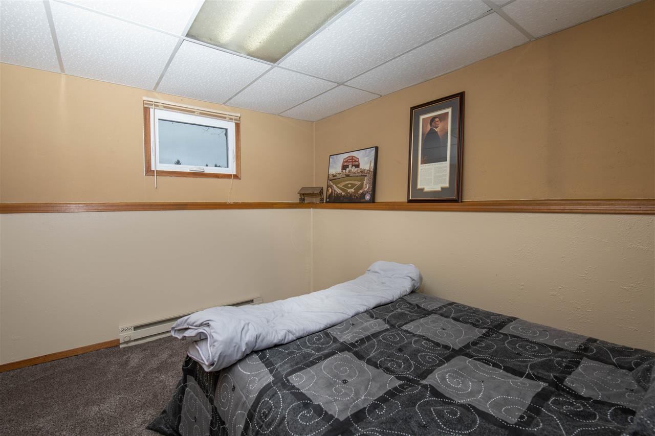 1098 Drexel Road Lake Summerset, IL 61019 - Photo 21 of 25 a close up of a bed in a room