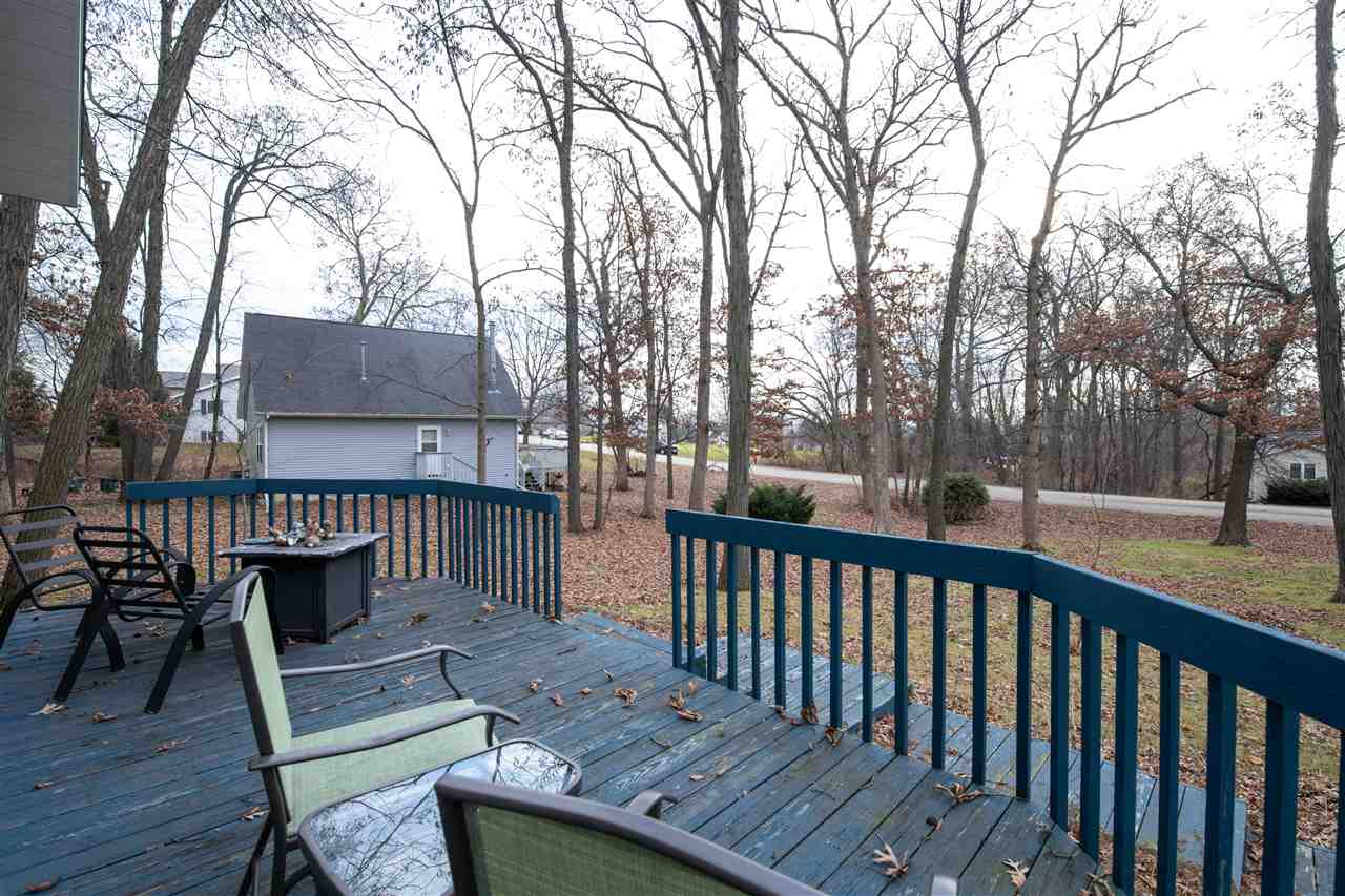 1098 Drexel Road Lake Summerset, IL 61019 - Photo 23 of 25 a view of a deck with a table and chair