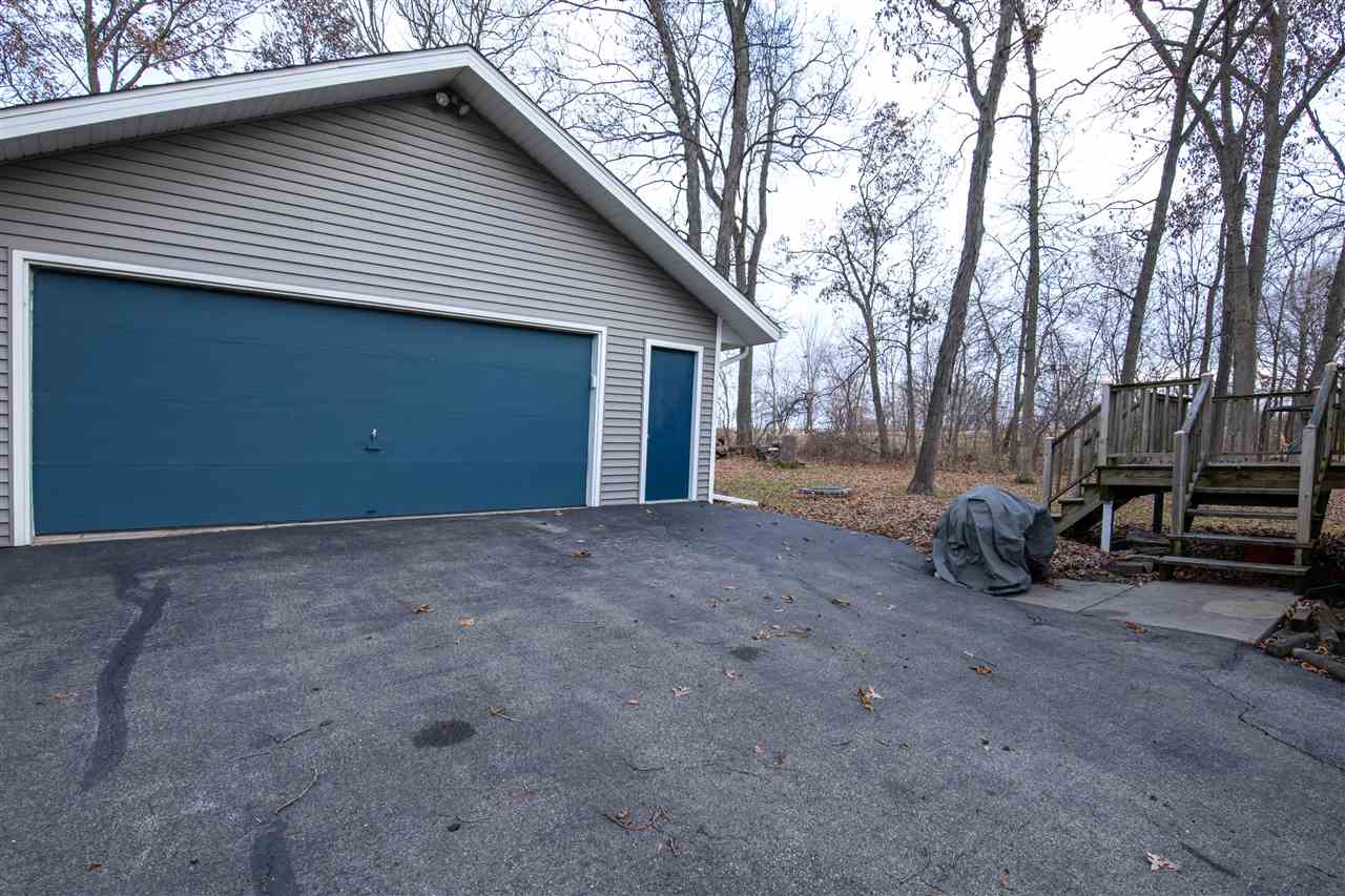 1098 Drexel Road Lake Summerset, IL 61019 - Photo 24 of 25 a view of backyard with barbeque grill and a large tree