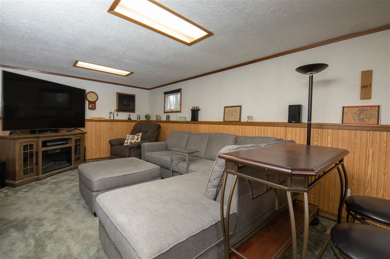 1098 Drexel Road Lake Summerset, IL 61019 - Photo 7 of 25 a living room with furniture and a flat screen tv