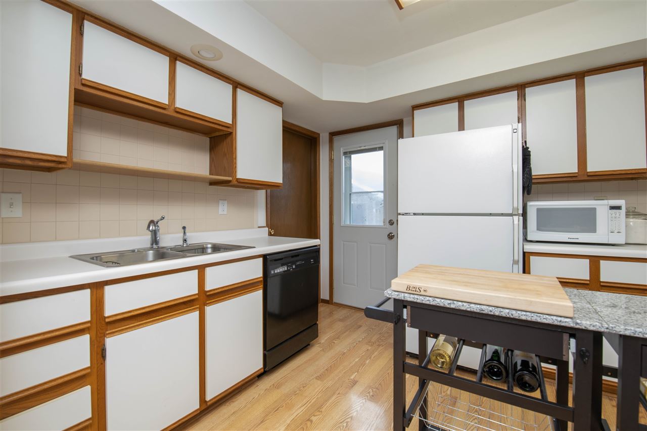1098 Drexel Road Lake Summerset, IL 61019 - Photo 10 of 25 a kitchen with stainless steel appliances granite countertop a refrigerator sink and cabinets