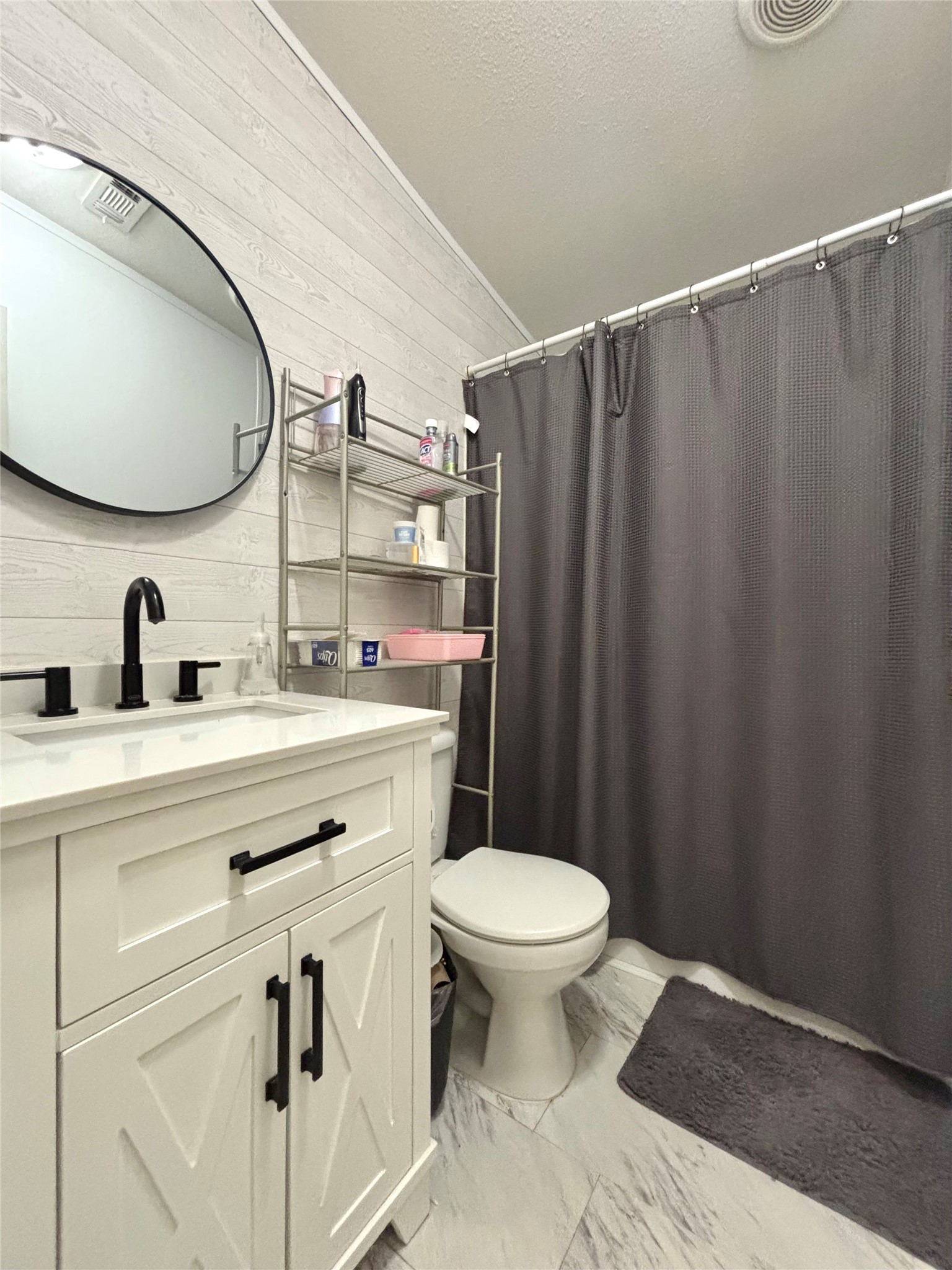 1580 Farm To Market 1745 Colmesneil, TX 75938 - Photo 19 of 36 a bathroom with a sink a toilet and a mirror
