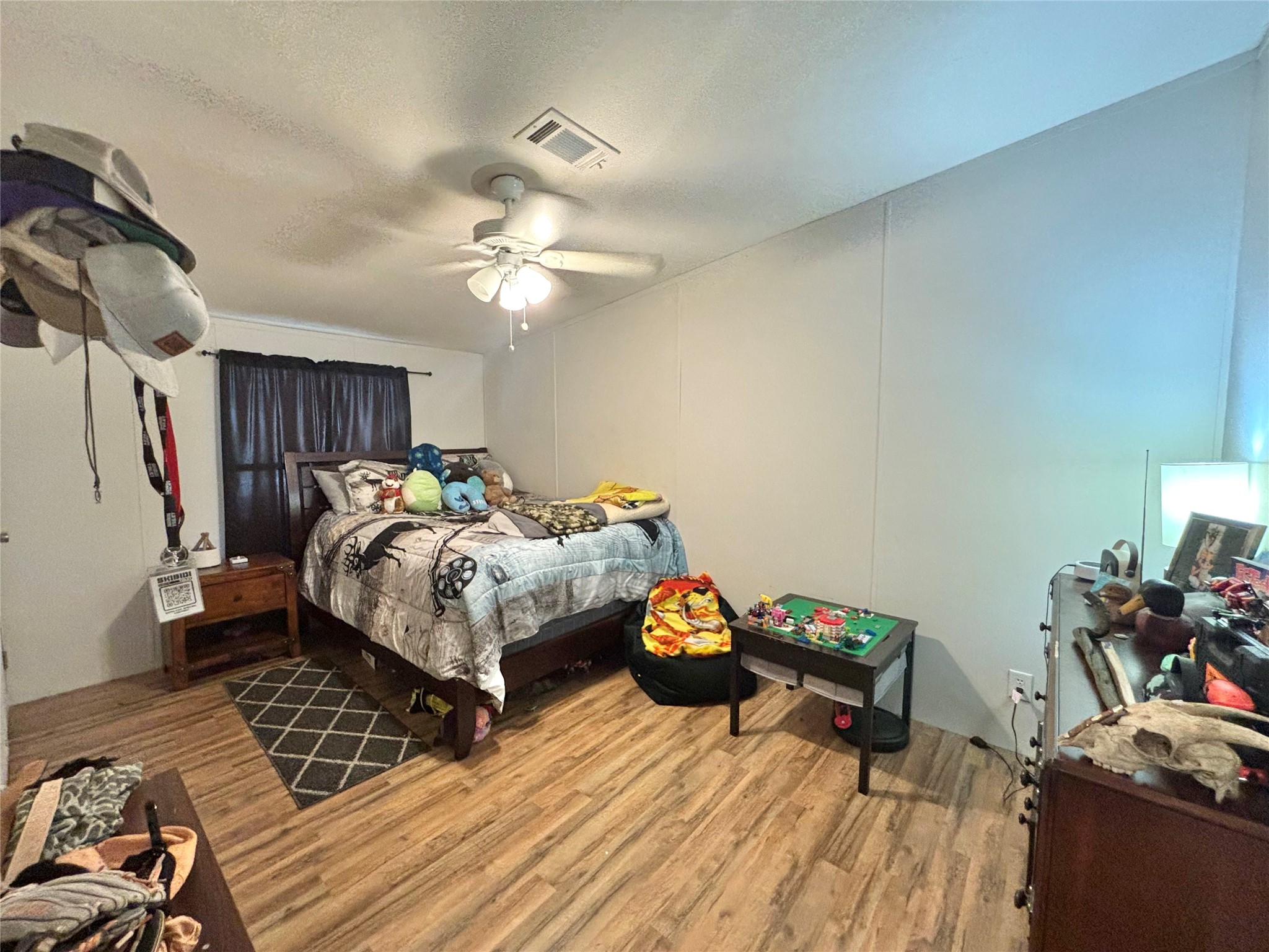 1580 Farm To Market 1745 Colmesneil, TX 75938 - Photo 20 of 36 a bed room with a bed and a chandelier