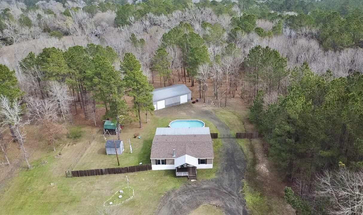 1580 Farm To Market 1745 Colmesneil, TX 75938 - Photo 2 of 36 a aerial view of a house with a yard