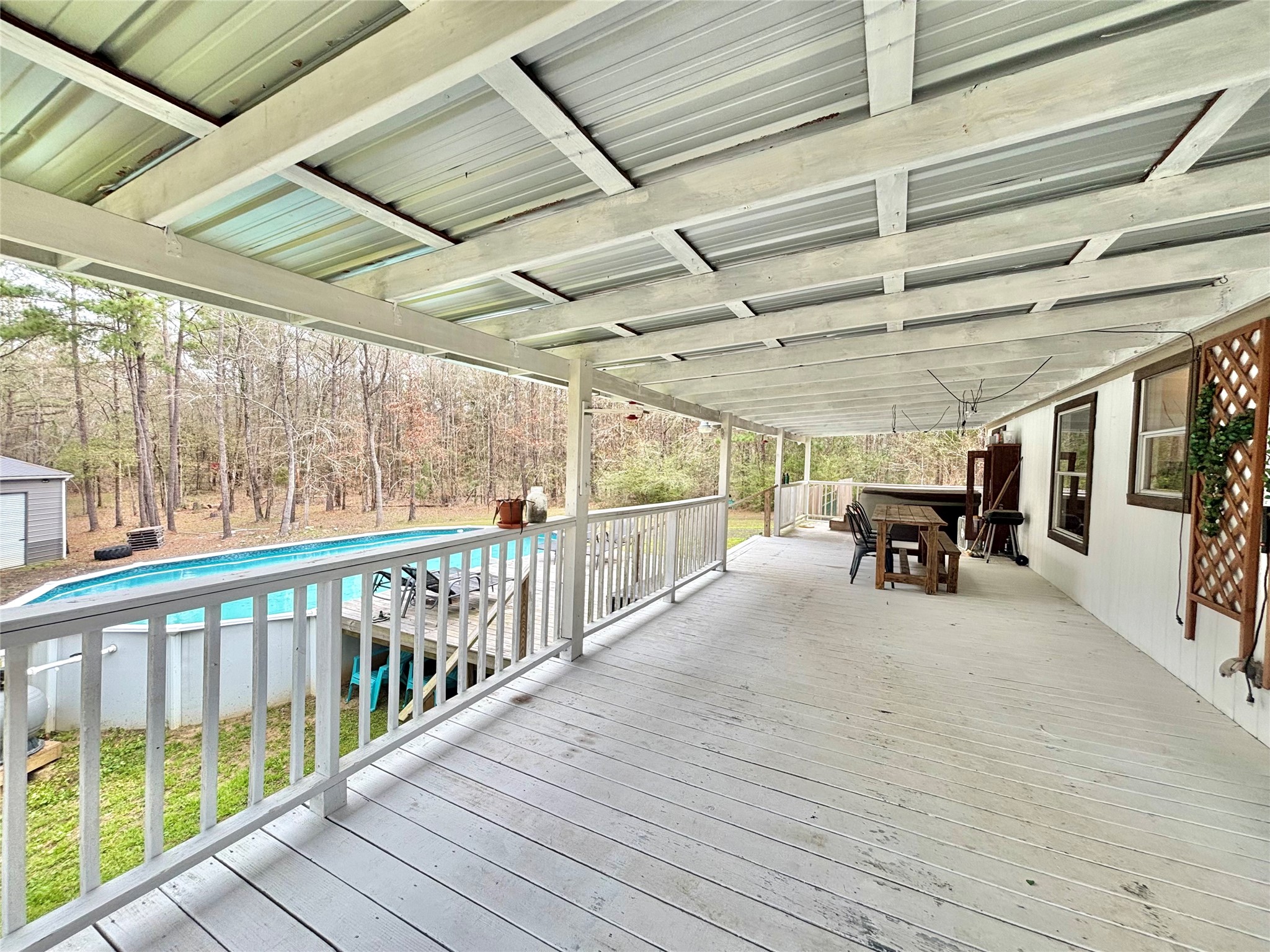 1580 Farm To Market 1745 Colmesneil, TX 75938 - Photo 22 of 36 a view of a porch with furniture and a bed