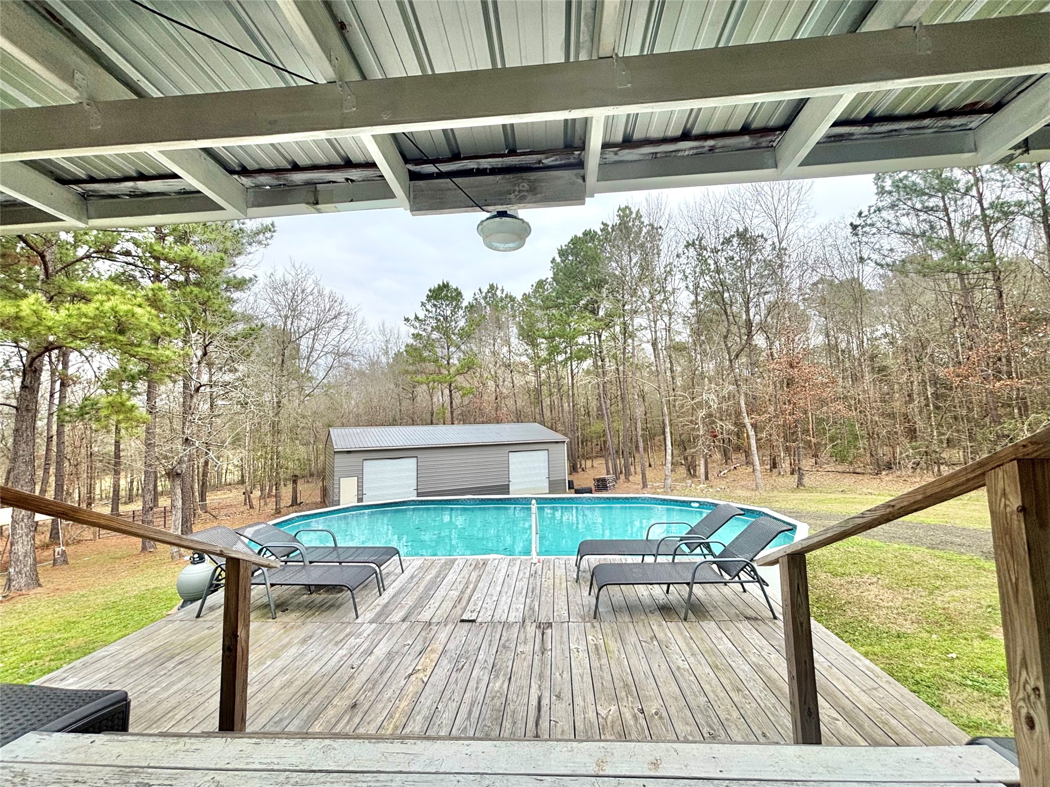 1580 Farm To Market 1745 Colmesneil, TX 75938 - Photo 25 of 36 a view of balcony with wooden floor and outdoor seating