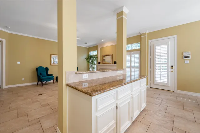 a kitchen with stainless steel appliances granite countertop a sink and a granite counter tops