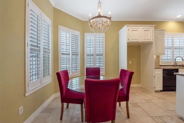 a view of a dining room with furniture and windows