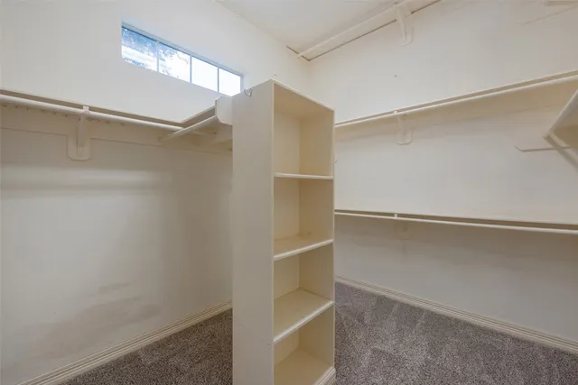 a view of an empty walk in closet