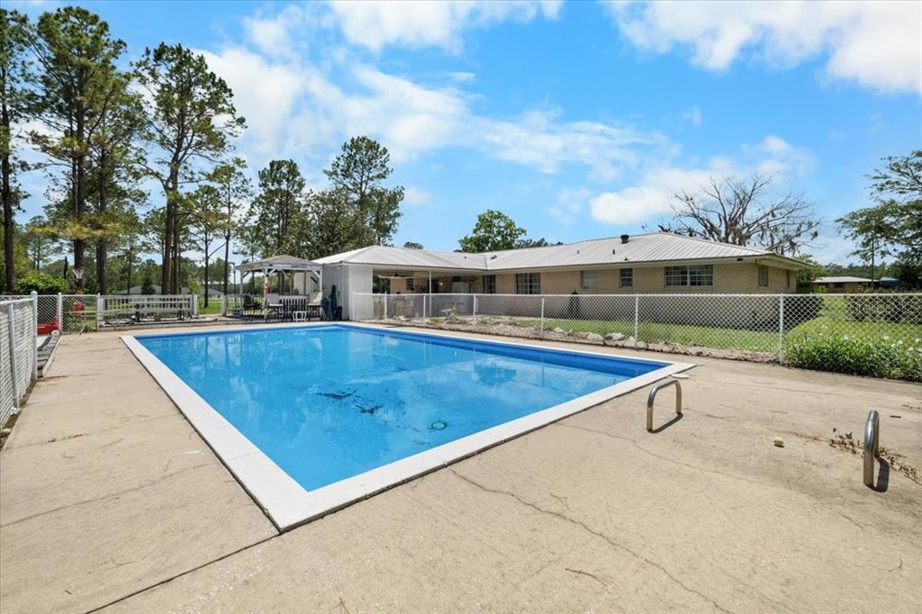 7422 County Road 231 Lake Butler, FL 32054 - Photo 45 of 57 swimming pool view with a seating space