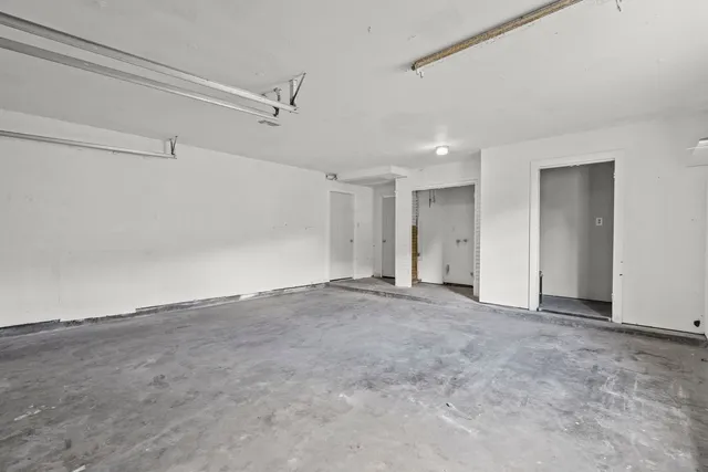 a view of an empty room with a ceiling fan