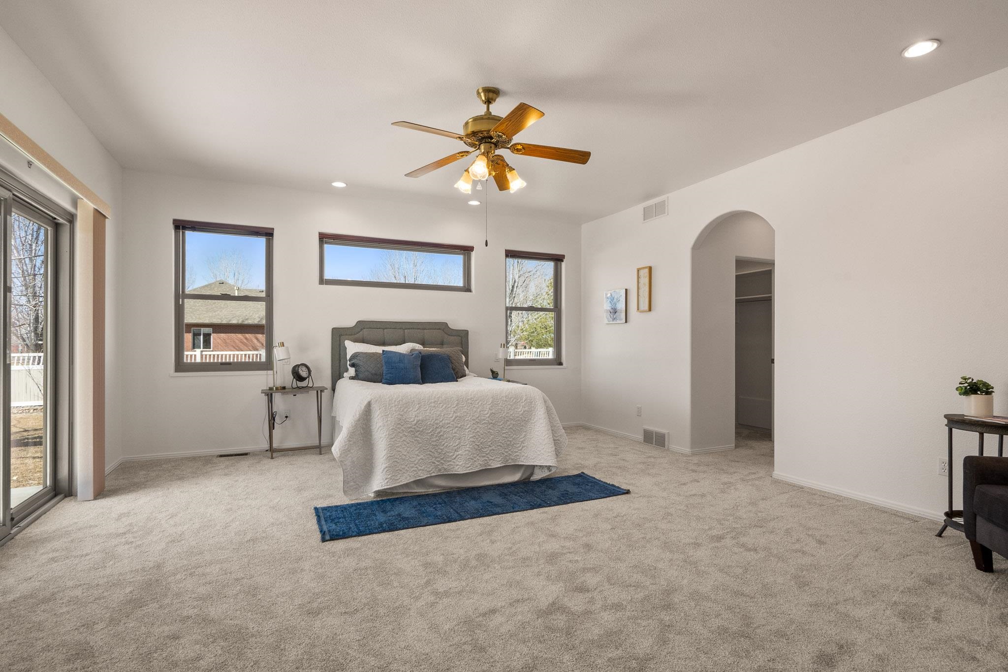 2107 I I- 1/2 Road Grand Junction, CO 81505 - Photo 21 of 42 a bedroom with a bed and a chandelier