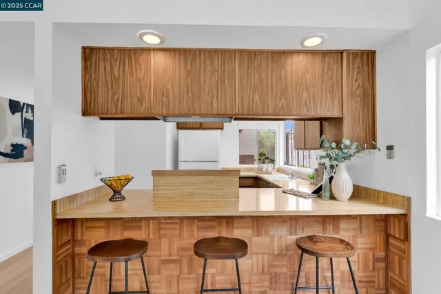a kitchen with a table and chairs in it