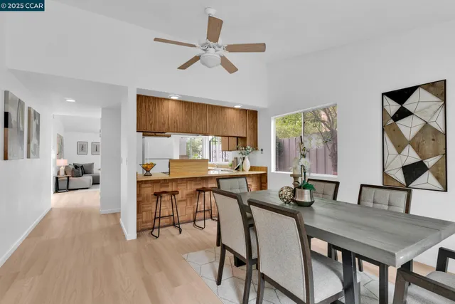 a view of a dining room with furniture and a livingroom