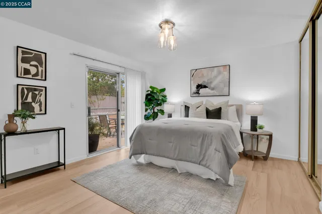 a bedroom with a bed and a lamp