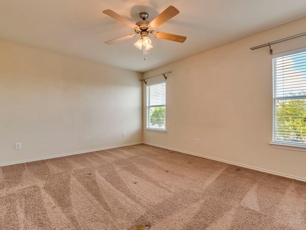 6 Verde Ranch Loop Leander, TX 78641 - Photo 13 of 24 an empty room with windows and fan