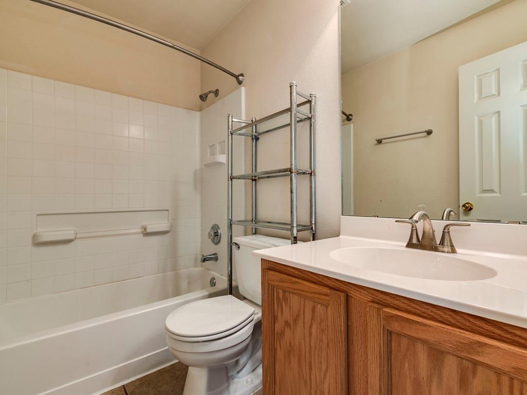6 Verde Ranch Loop Leander, TX 78641 - Photo 19 of 24 a bathroom with a sink toilet and shower