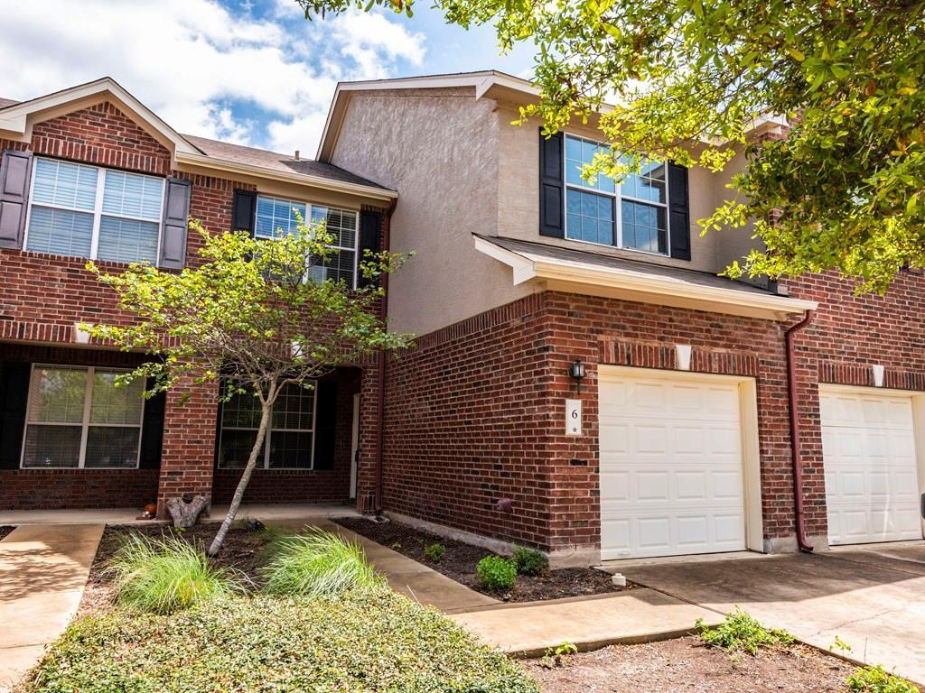 6 Verde Ranch Loop Leander, TX 78641 - Photo 2 of 24 a front view of a house with garden