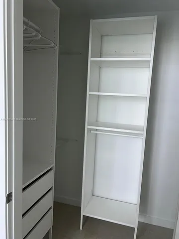 a view of an empty walk in closet