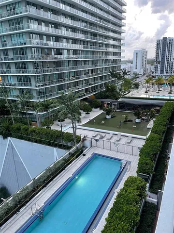 a view of a pool with a patio