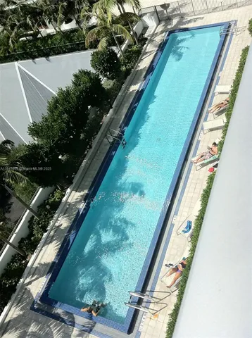 a view of swimming pool from a balcony