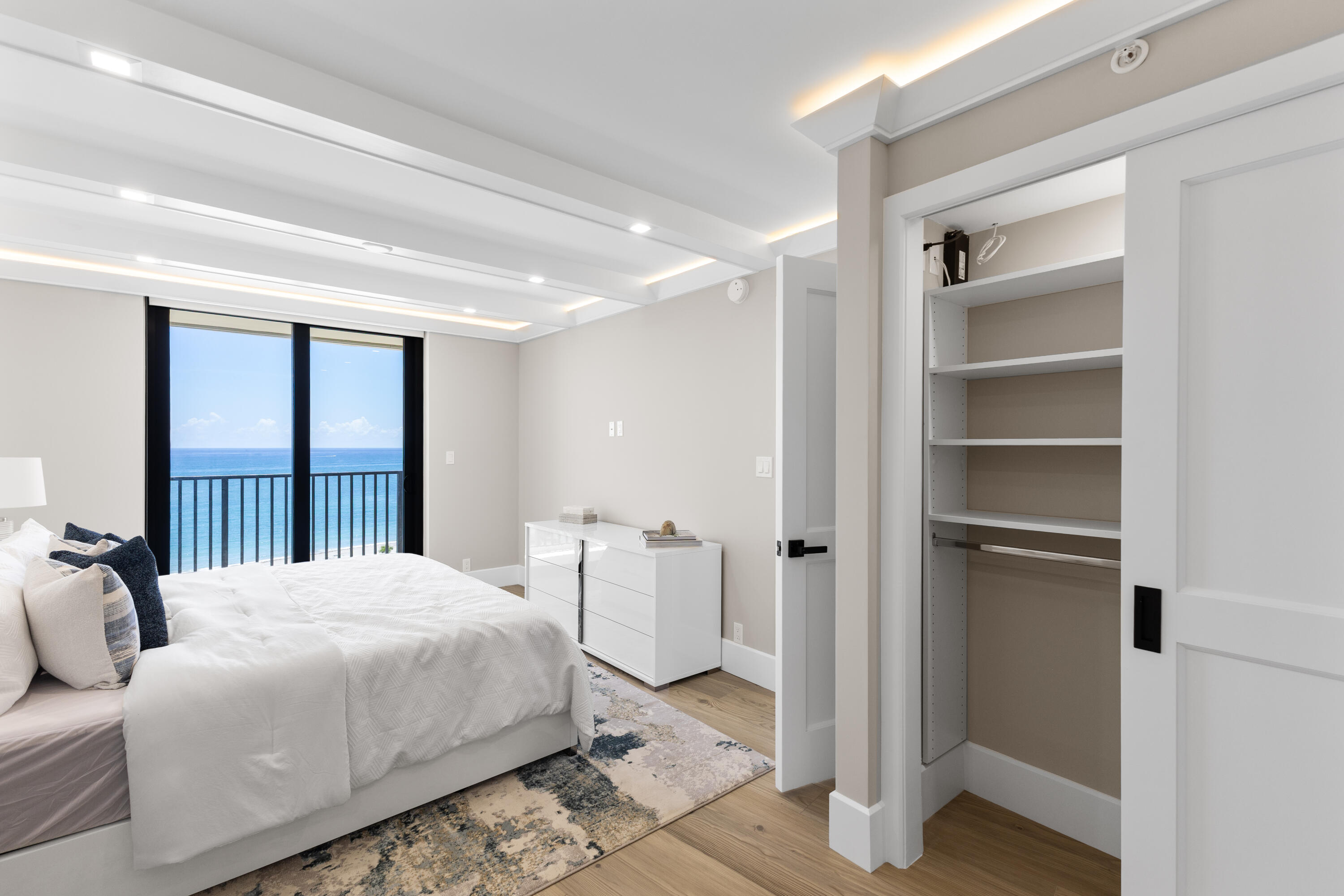 400 Ocean Trail Way, Unit 1008 Jupiter, FL 33477 - Photo 13 of 32 a bedroom with a bed and a large window