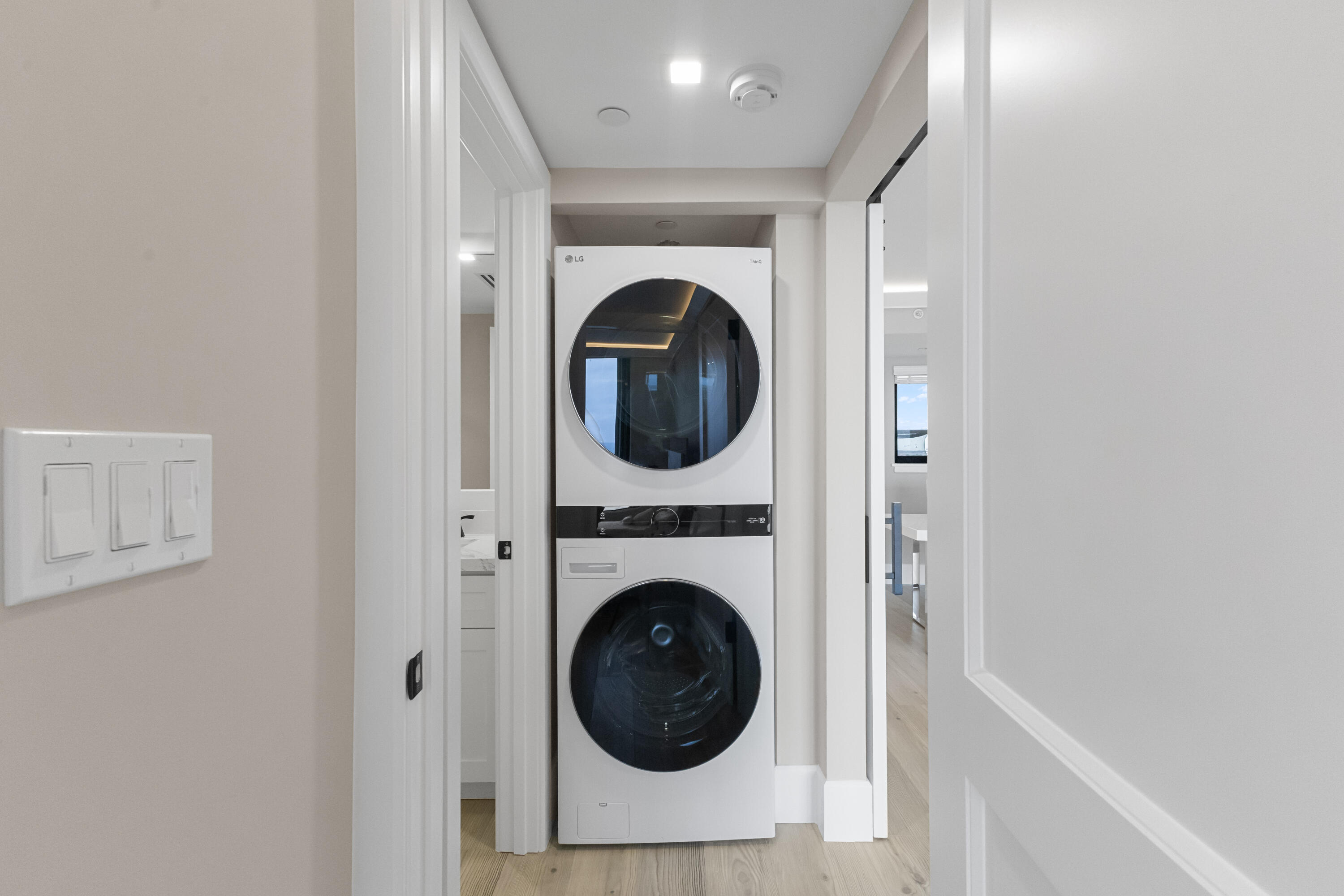 400 Ocean Trail Way, Unit 1008 Jupiter, FL 33477 - Photo 17 of 32 a view of a hallway with washer and dryer