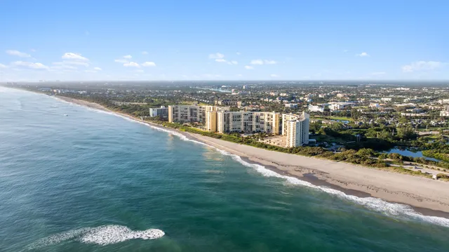 a view of a swimming pool with outdoor seating