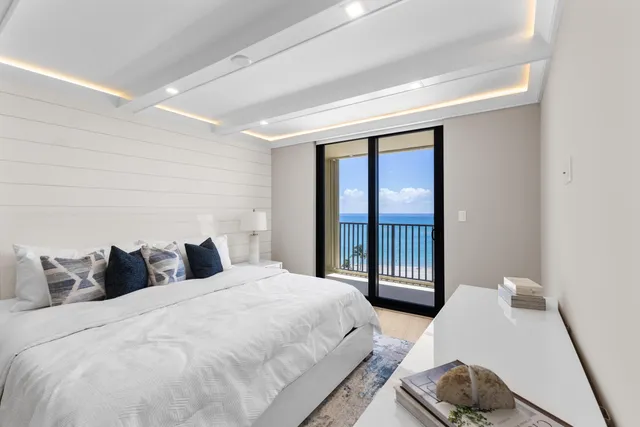 a bedroom with a bed and a night stand