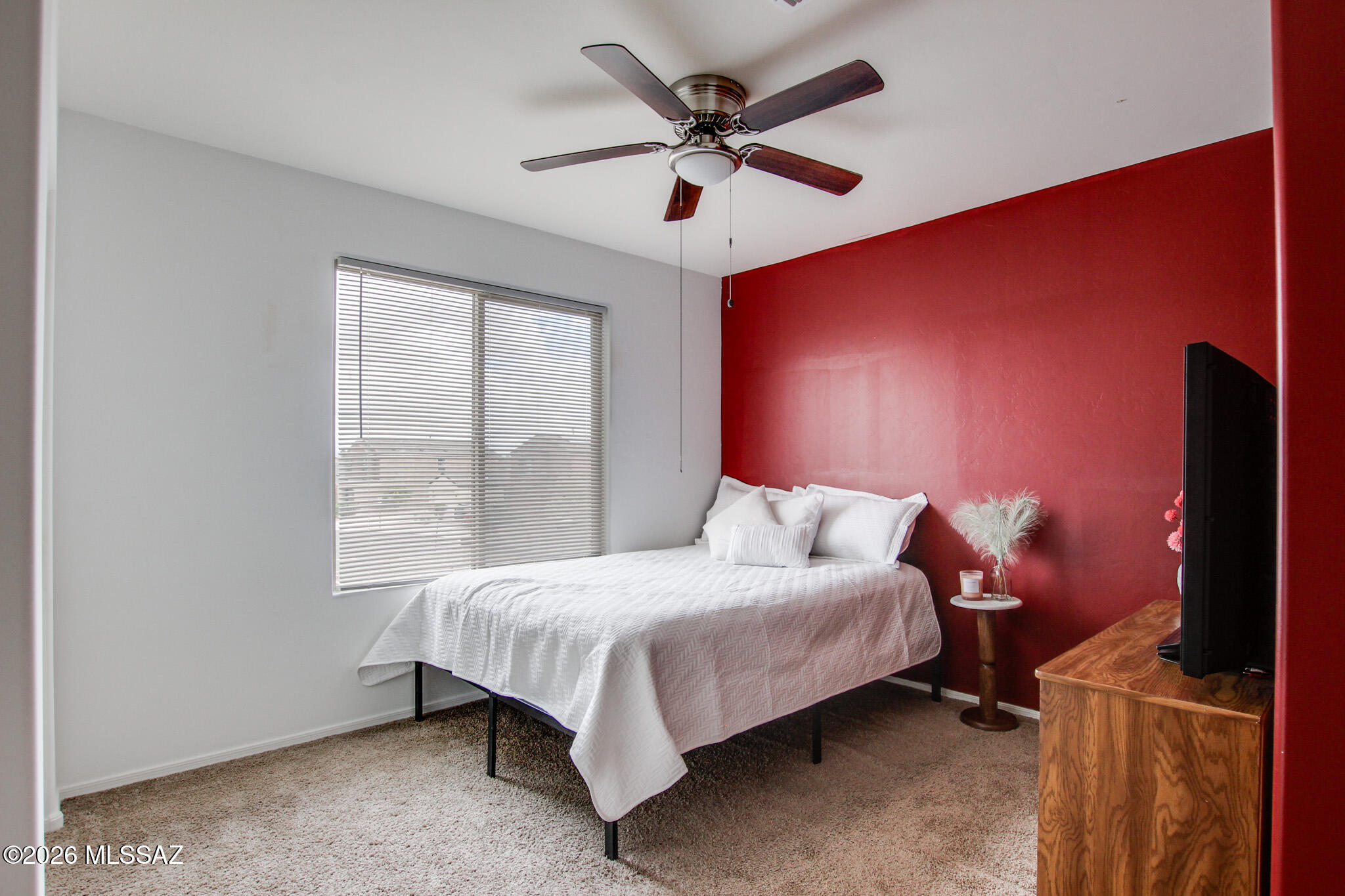 5987 South Antrim Loop Tucson, AZ 85706 - Photo 25 of 34 a bedroom with a bed and a ceiling fan