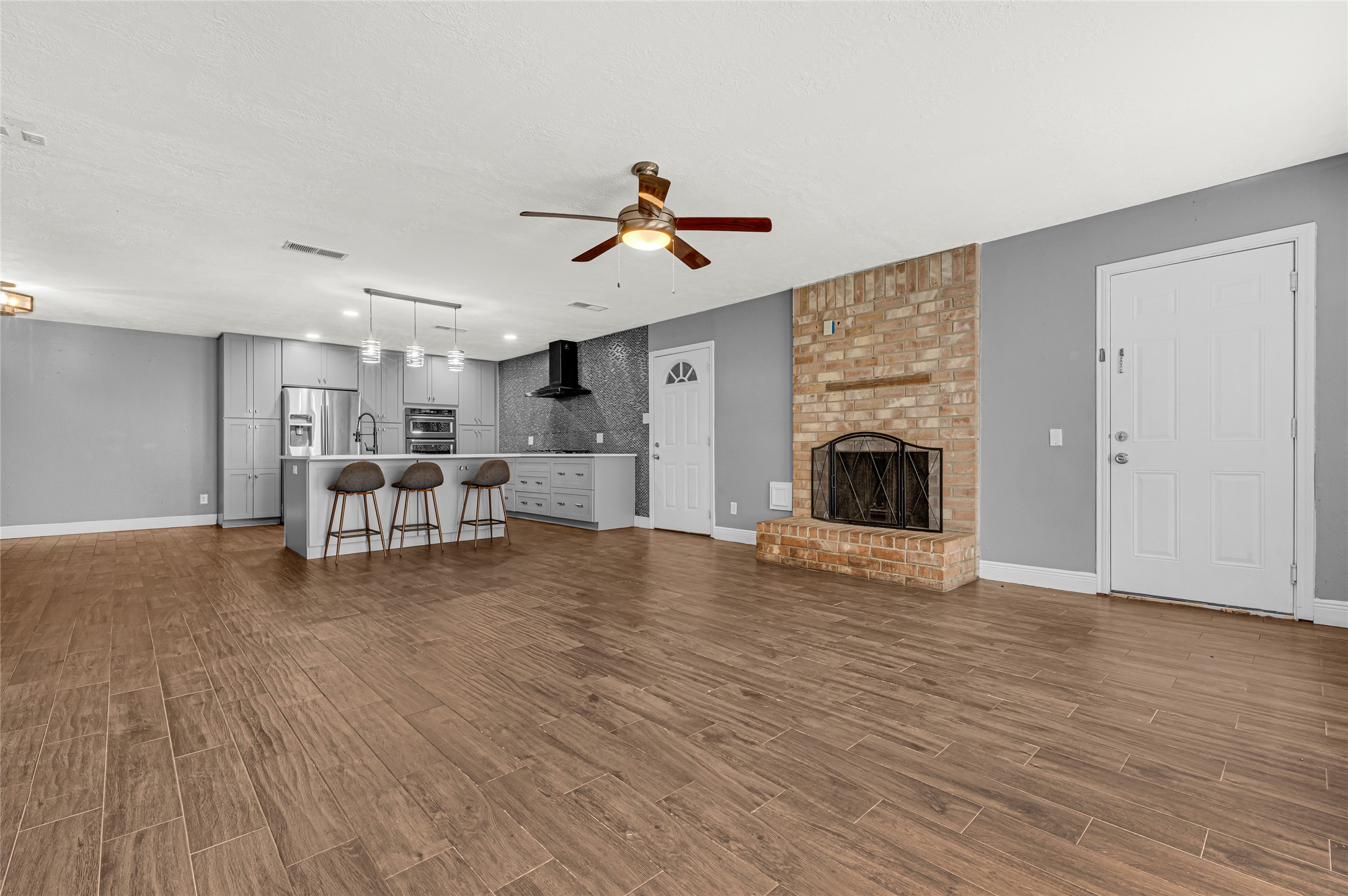 4170 Amir Street Houston, TX 77072 - Photo 4 of 18 a living room with furniture and a fireplace