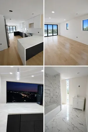 a upper view of a kitchen with stainless steel appliances kitchen island sink refrigerator and stove