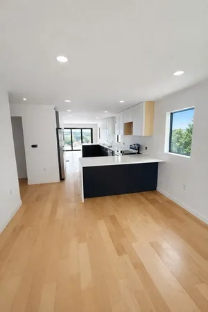 a view of kitchen and kitchen with stainless steel appliances
