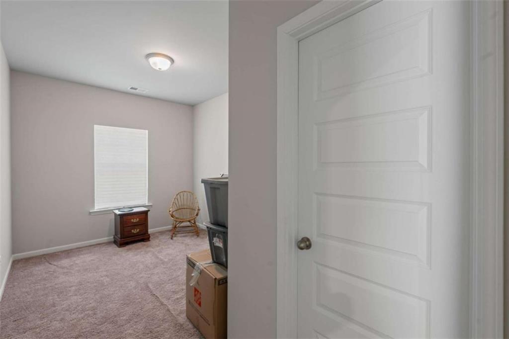 9068 Jim Purcell Drive Covington, GA 30014 - Photo 33 of 48 a view of a hallway with closet