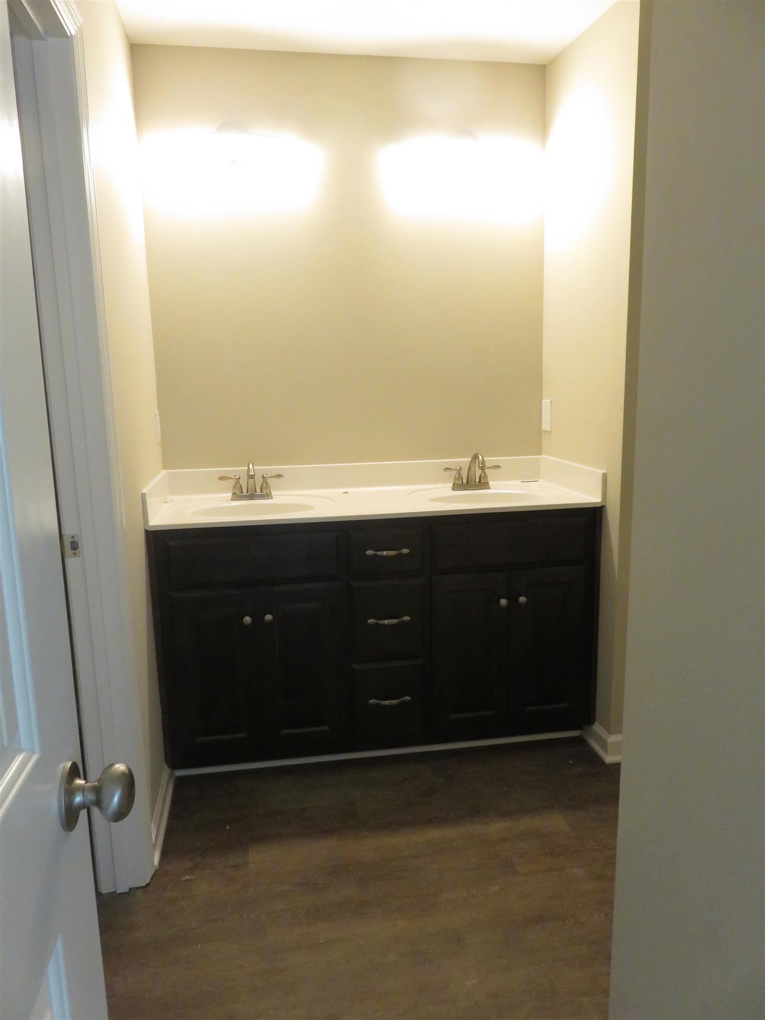 51 Shipley Road Manchester, TN 37355 - Photo 4 of 13 Master bath with chocolate cabinets, double vanities, walk in shower and walk in closet