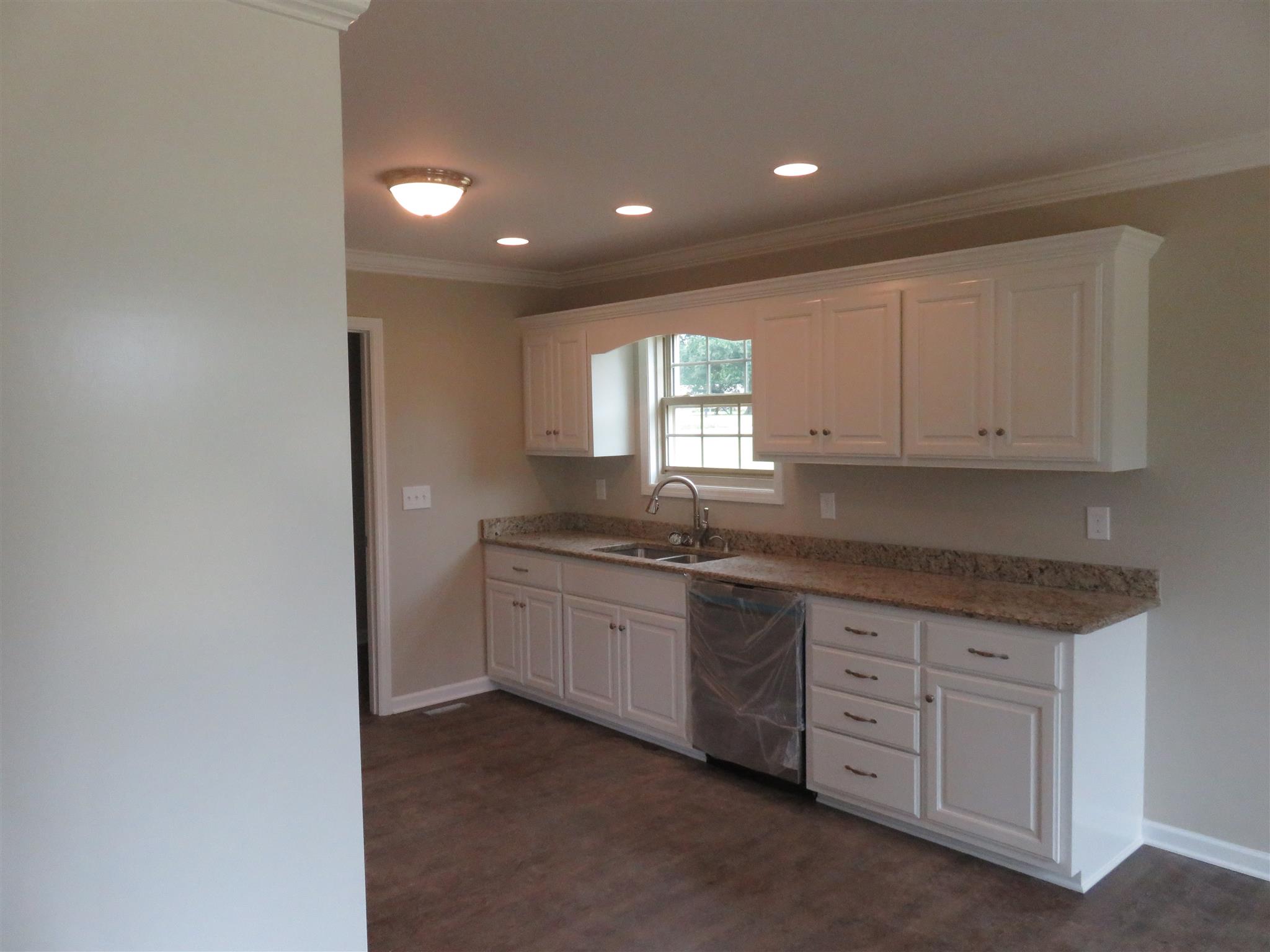 51 Shipley Road Manchester, TN 37355 - Photo 7 of 13 Another angle of this great size kitchen with stainless steel appliances, granite counter tops and can lights for plenty of light.