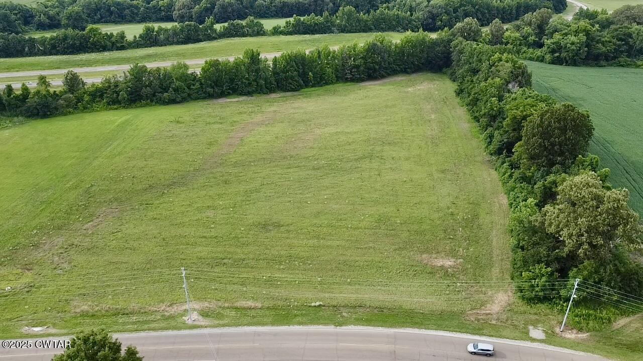 0 Community Park Road Dyersburg, TN 38024 - Photo 1 of 5 a view of a yard with a wooden fence
