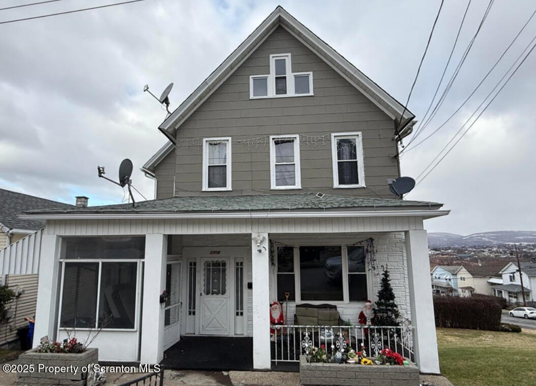 1706 Prospect Avenue, Unit REAR Scranton, PA 18505 - Photo 1 of 18 a front view of a house with a porch