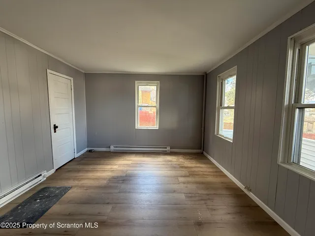 a view of an empty room and window