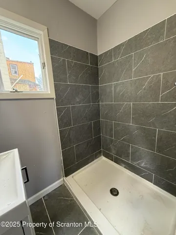 a bathroom with a bath tub