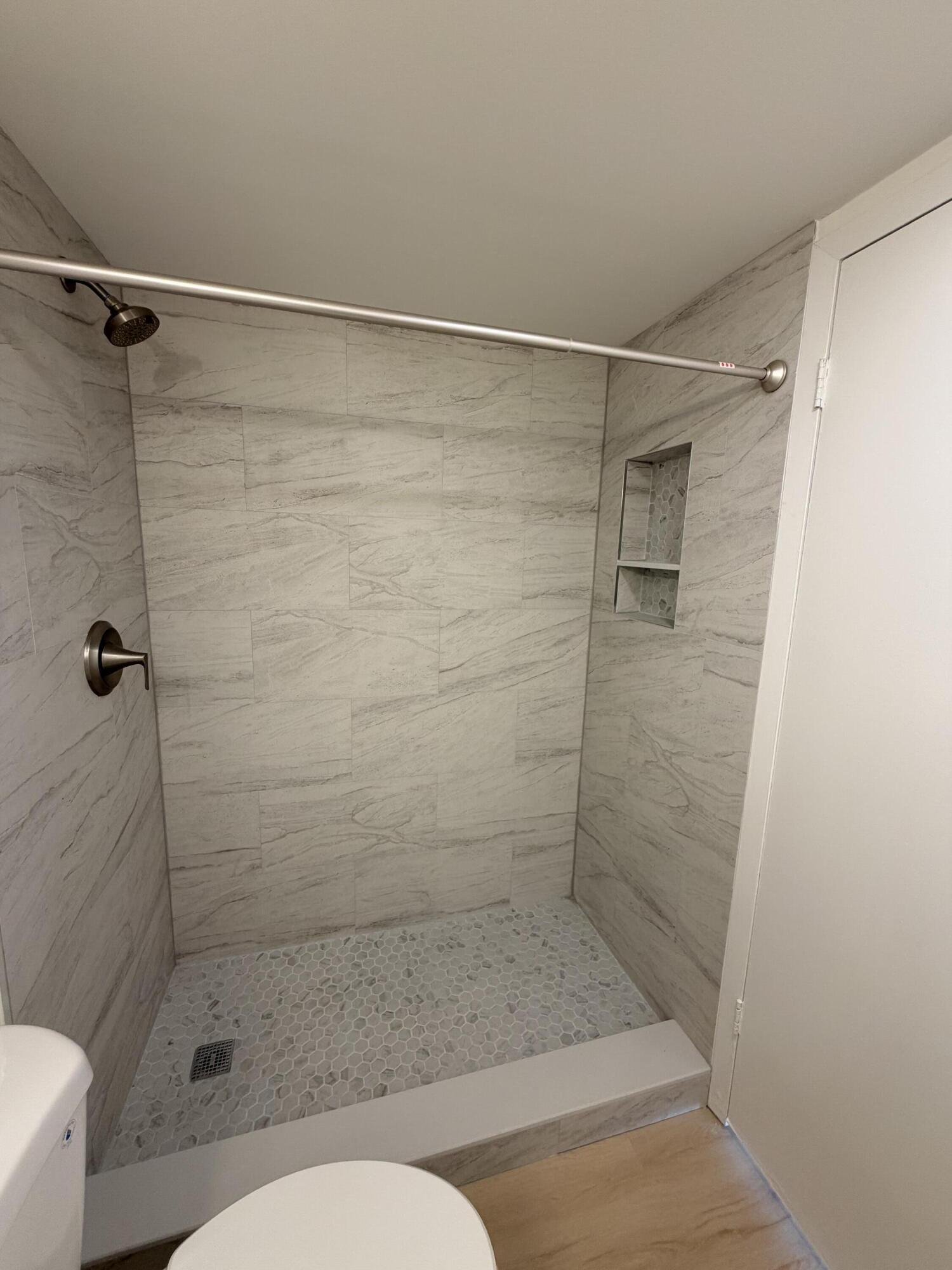 37 Suffolk Way Boca Raton, FL 33434 - Photo 32 of 40 a bathroom with a shower and a toilet