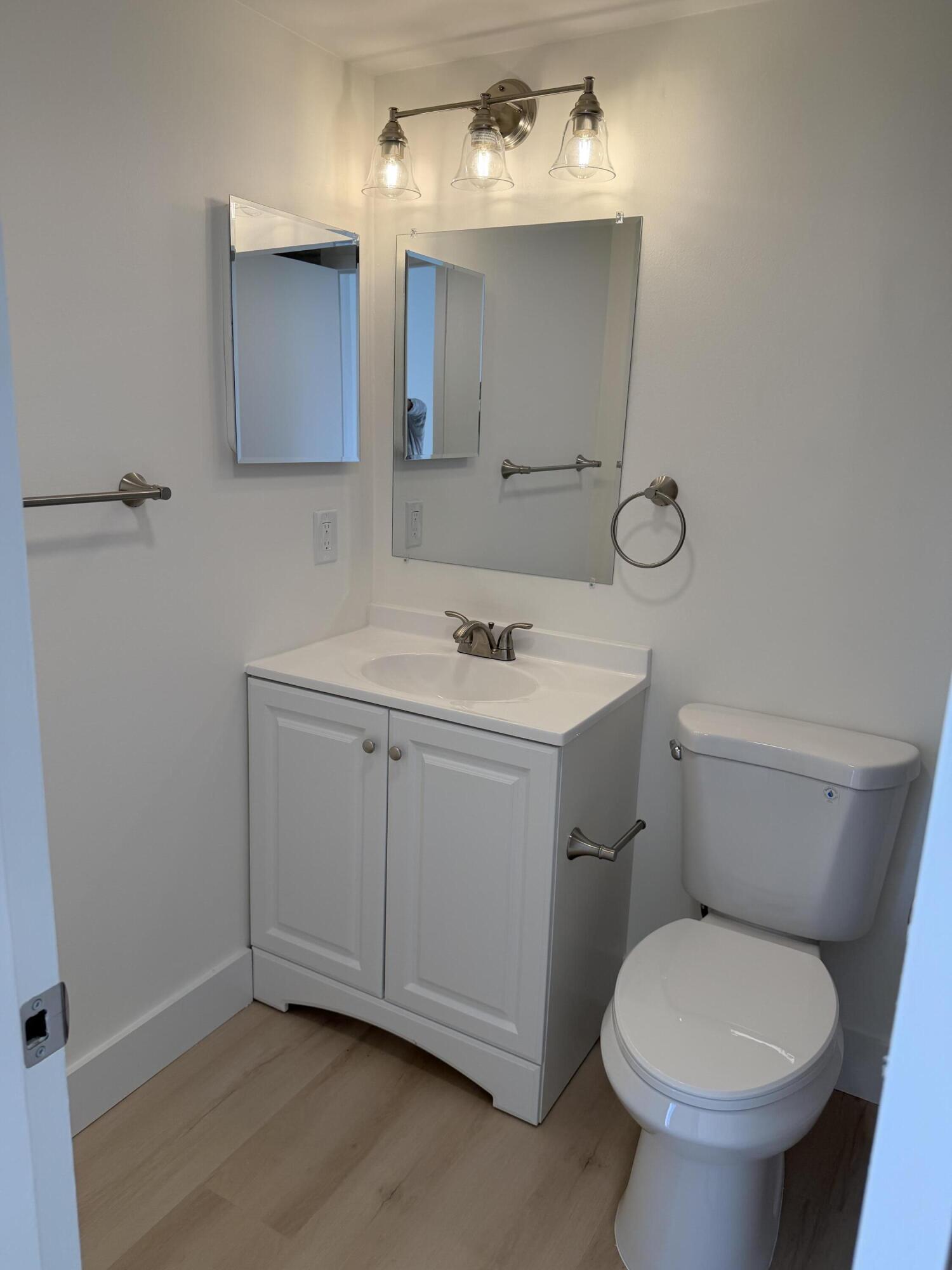 37 Suffolk Way Boca Raton, FL 33434 - Photo 39 of 40 a bathroom with a sink toilet and mirror