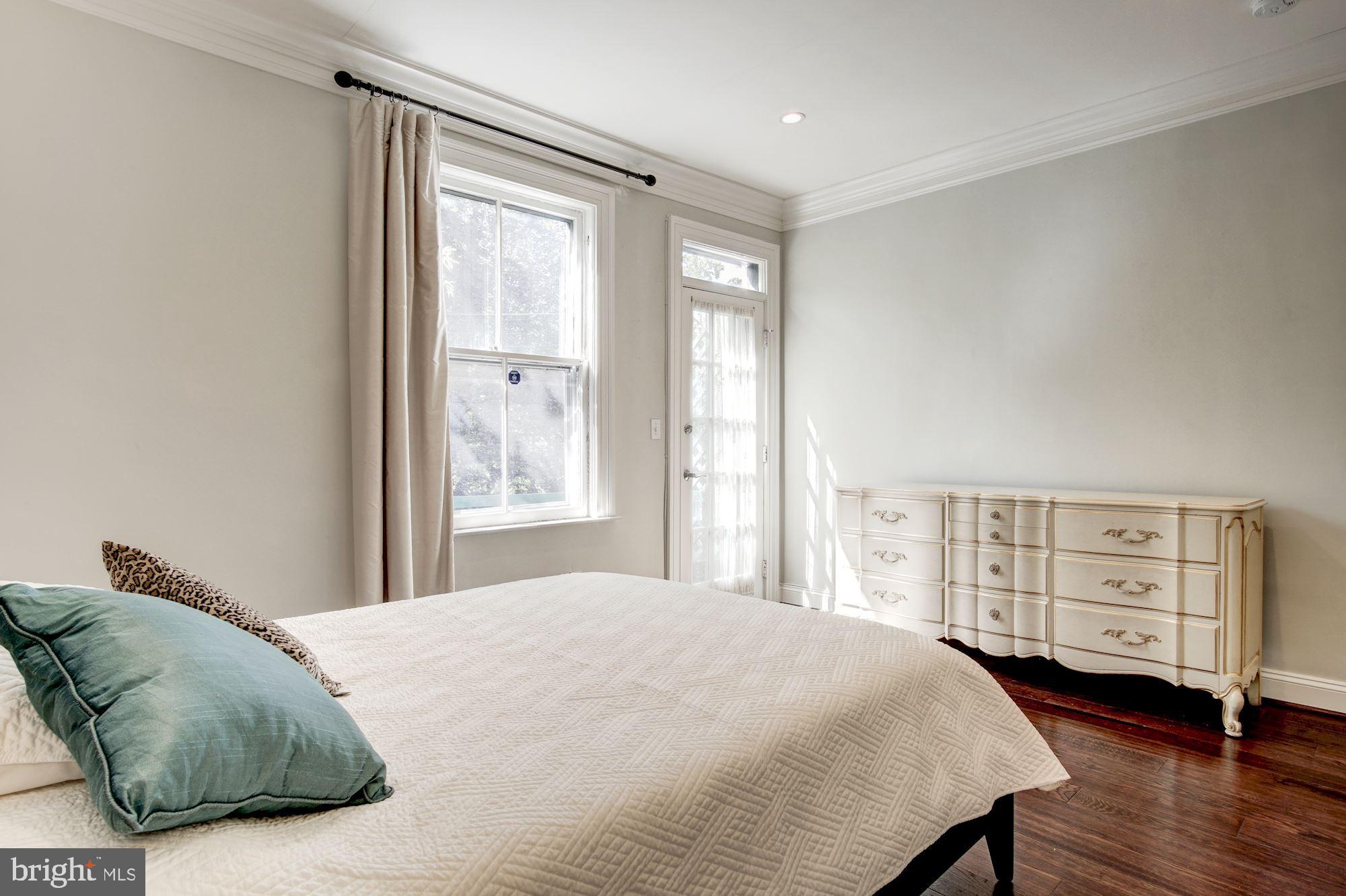 3040 R Street Northwest, Unit 1/2 Washington, DC 20007 - Photo 11 of 33 a bedroom with a bed and a window