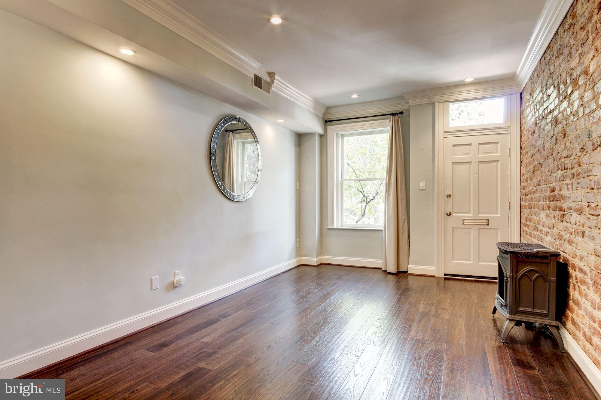3040 R Street Northwest, Unit 1/2 Washington, DC 20007 - Photo 17 of 33 a view of a livingroom with wooden floor and window