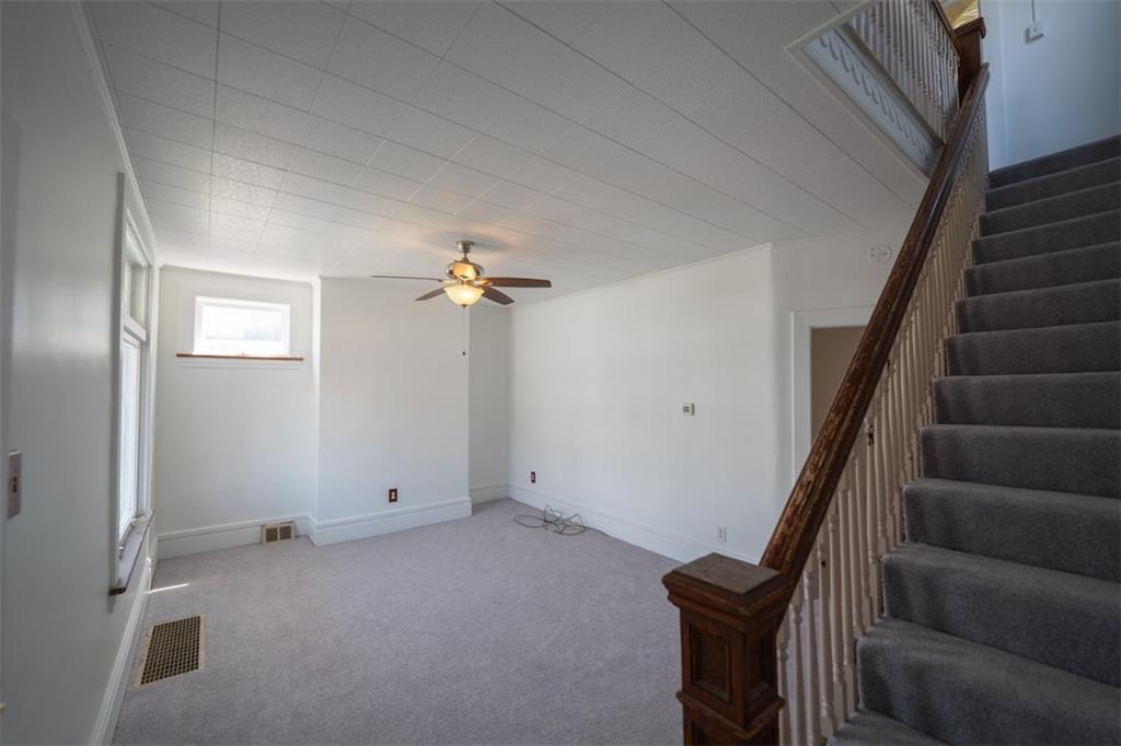392 Vermont Avenue Rochester, PA 15074 - Photo 3 of 17 wooden floor in an empty room with a window