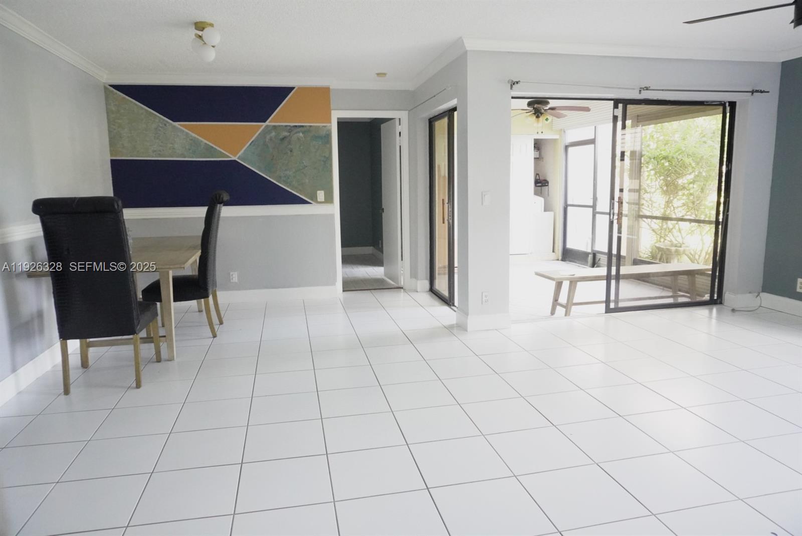 3350 Northwest 47th Avenue, Unit 3273 Coconut Creek, FL 33063 - Photo 3 of 11 a view of an empty room with a window