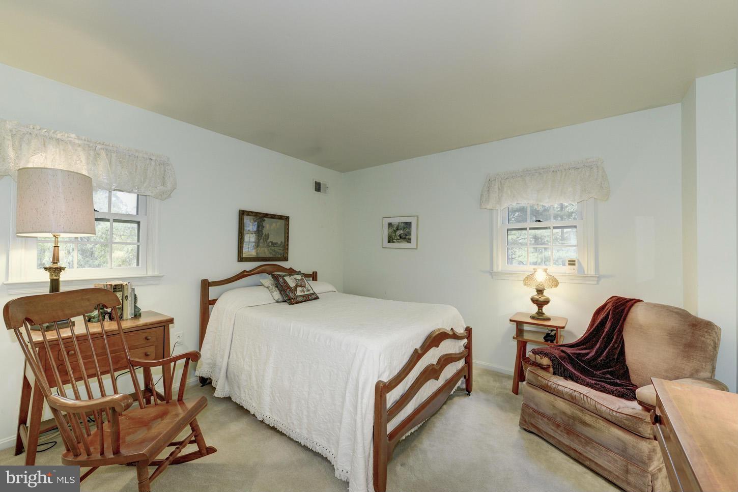 1621 Gamewell Road Silver Spring, MD 20905 - Photo 22 of 30 a bedroom with a bed and wooden floor