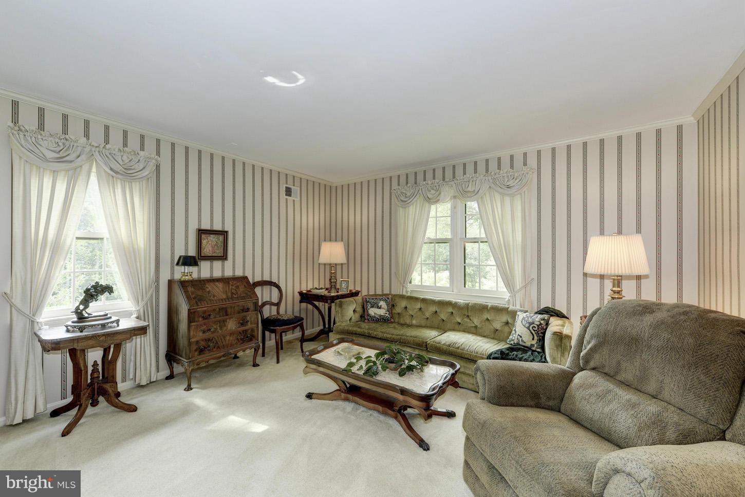 1621 Gamewell Road Silver Spring, MD 20905 - Photo 8 of 30 a living room with furniture and a large window