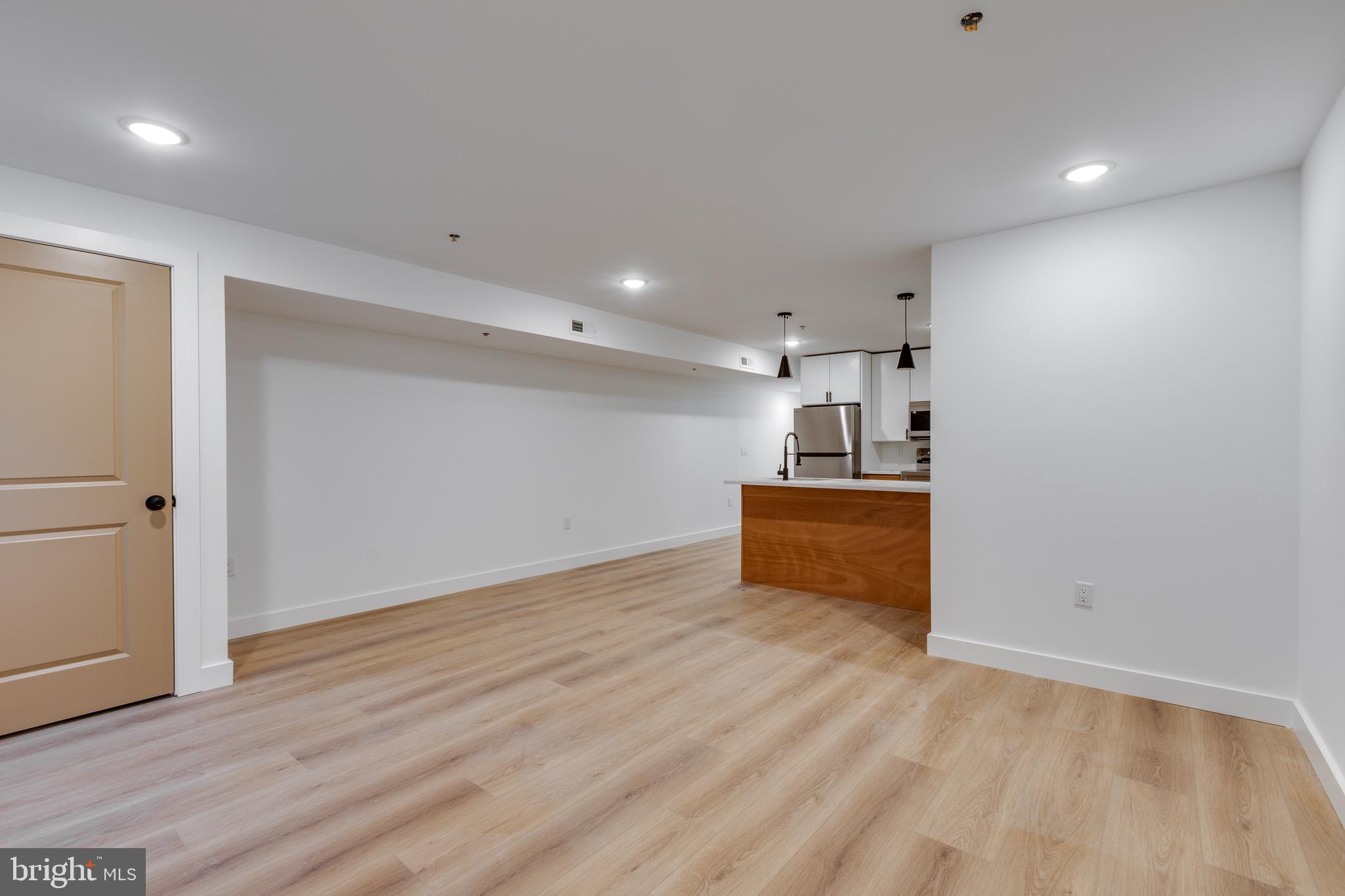 2203 North 7th Street, Unit 2 Philadelphia, PA 19133 - Photo 3 of 12 a view of a kitchen with a sink and a refrigerator