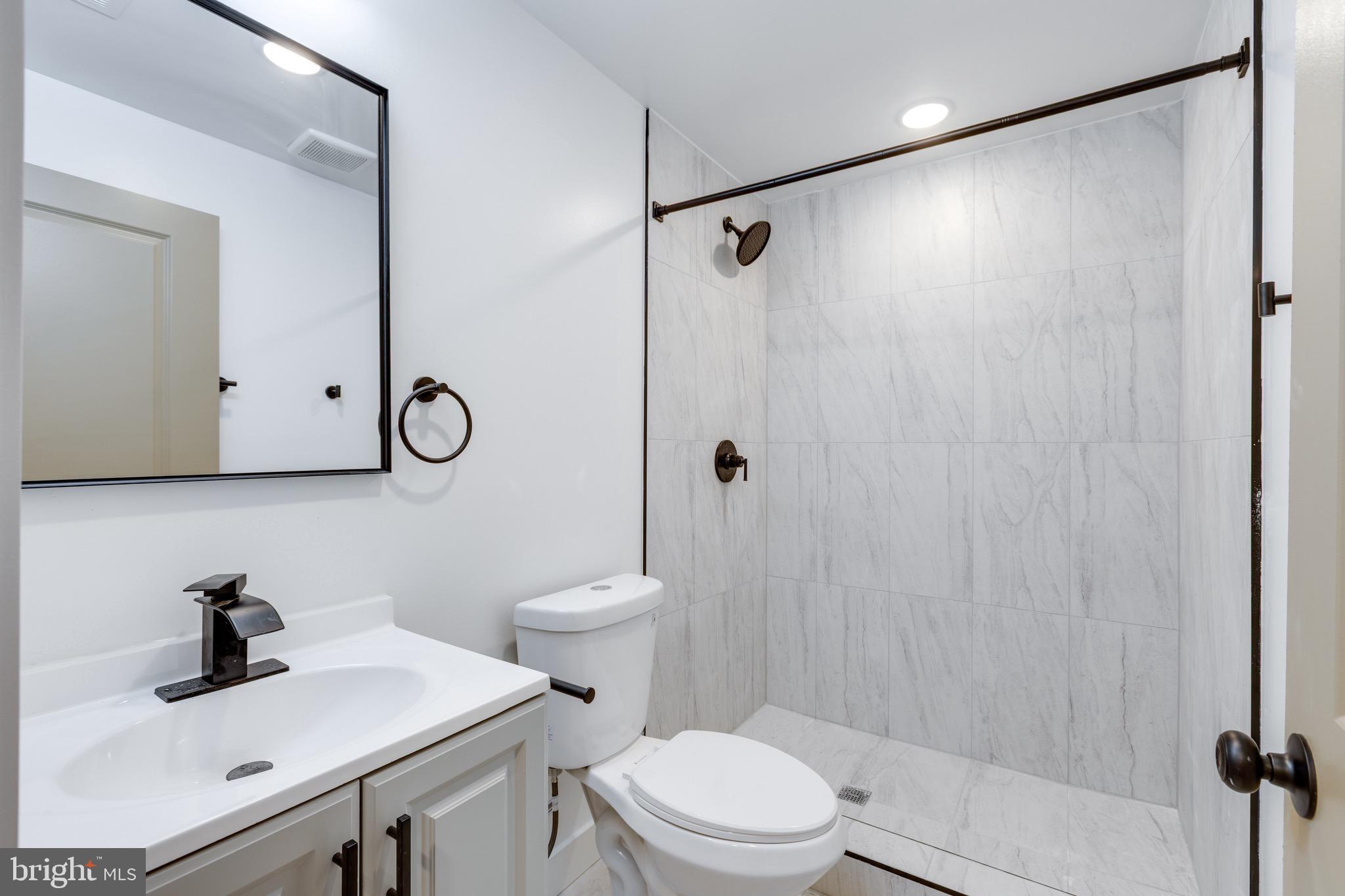 2203 North 7th Street, Unit 2 Philadelphia, PA 19133 - Photo 8 of 12 a bathroom with a sink toilet and shower